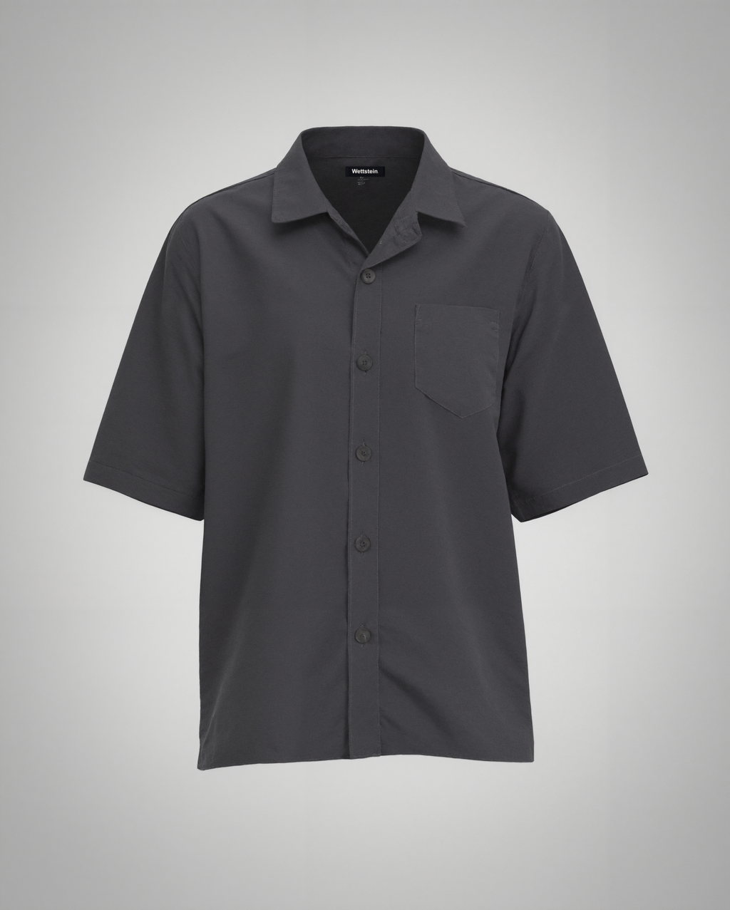 A black short-sleeve button-up shirt with a regular fit, made from 100% organically grown cotton. Designed with a structured spread collar, a single square chest pocket with precise topstitching, and a clean five-button front closure with tonal matte black buttons. The lightweight fabric has a soft matte finish, creating a refined yet relaxed silhouette.